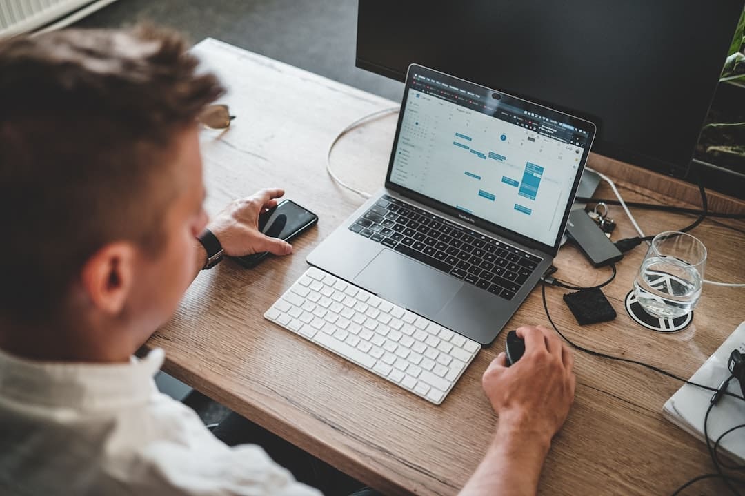 Marketer reviewing a CRM dashboard on a laptop at a desk